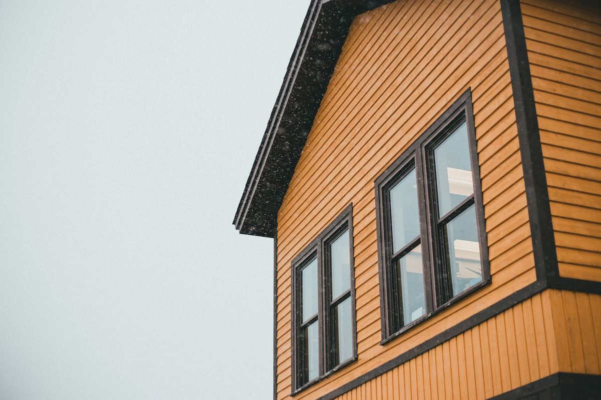 Contractor installing new siding